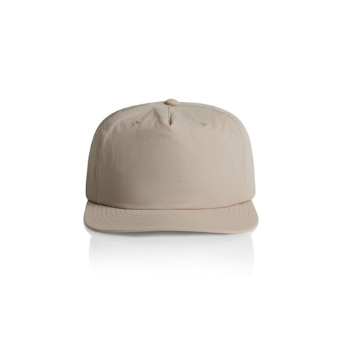 A beige cap with a curved brim and a top button, featuring a logo on the front.