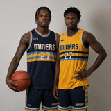 Two basketball players wearing reversible Miners Core singlets in navy blue and yellow, shown front view with a classic U-neck design. 